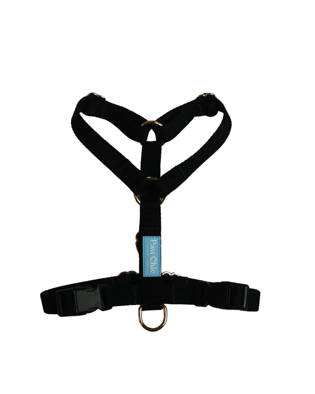 Adjustable black dog harness with metal rings and label, pet accessory on black background